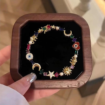 💫 LIMITED-TIME 50% RABATT +  2 kaufen 1 gratis! ✨ Himmelscharme-Armband – Sonne, Mond, Sterne, Kristalle, Goldton 🪐